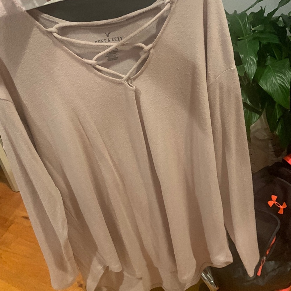 Plush pink long sleeve sweater with a strapy v neck